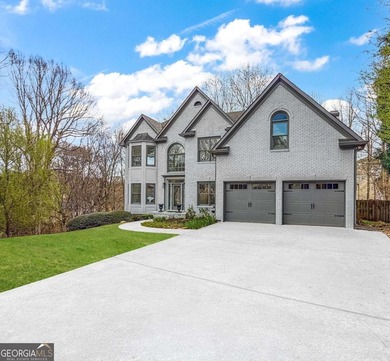 Welcome to this beautifully updated 5-bedroom, 3.5-bath home in on Towne Lake Hills Golf Club in Georgia - for sale on GolfHomes.com, golf home, golf lot