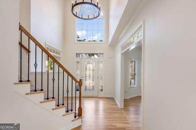 Welcome to this beautifully updated 5-bedroom, 3.5-bath home in on Towne Lake Hills Golf Club in Georgia - for sale on GolfHomes.com, golf home, golf lot