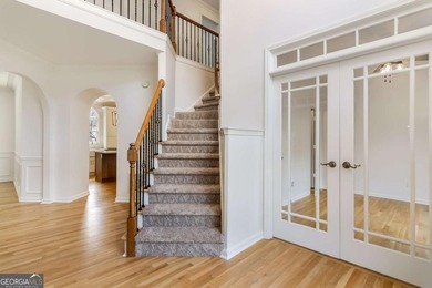 Welcome to this beautifully updated 5-bedroom, 3.5-bath home in on Towne Lake Hills Golf Club in Georgia - for sale on GolfHomes.com, golf home, golf lot