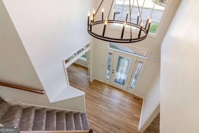 Welcome to this beautifully updated 5-bedroom, 3.5-bath home in on Towne Lake Hills Golf Club in Georgia - for sale on GolfHomes.com, golf home, golf lot