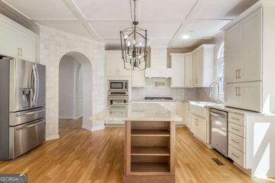 Welcome to this beautifully updated 5-bedroom, 3.5-bath home in on Towne Lake Hills Golf Club in Georgia - for sale on GolfHomes.com, golf home, golf lot