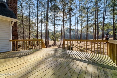 Experience modern living in this contemporary split-level home on Deercroft Golf and Country Club in North Carolina - for sale on GolfHomes.com, golf home, golf lot