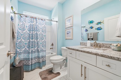 Experience the ease of coastal living in this impeccably on Surf Golf and Beach Club in South Carolina - for sale on GolfHomes.com, golf home, golf lot