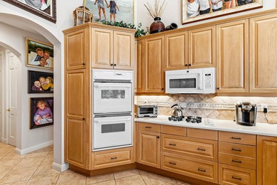 FULL GOLF MEMBERSHIP PURCHASE with this single-story residence on BallenIsles Golf and Country Club in Florida - for sale on GolfHomes.com, golf home, golf lot