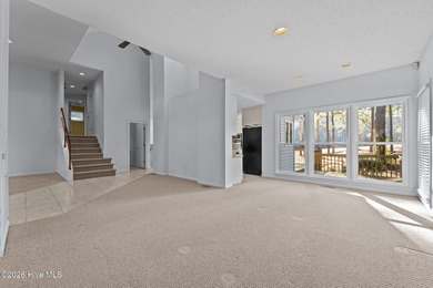 Experience modern living in this contemporary split-level home on Deercroft Golf and Country Club in North Carolina - for sale on GolfHomes.com, golf home, golf lot