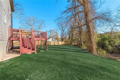 This stunning two-story home is just two years old and perfectly on East Lake Golf Club in Georgia - for sale on GolfHomes.com, golf home, golf lot