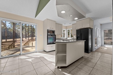 Experience modern living in this contemporary split-level home on Deercroft Golf and Country Club in North Carolina - for sale on GolfHomes.com, golf home, golf lot