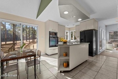 Experience modern living in this contemporary split-level home on Deercroft Golf and Country Club in North Carolina - for sale on GolfHomes.com, golf home, golf lot