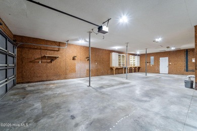 Experience modern living in this contemporary split-level home on Deercroft Golf and Country Club in North Carolina - for sale on GolfHomes.com, golf home, golf lot