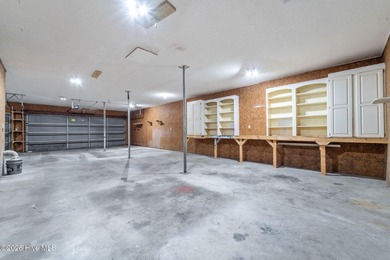 Experience modern living in this contemporary split-level home on Deercroft Golf and Country Club in North Carolina - for sale on GolfHomes.com, golf home, golf lot