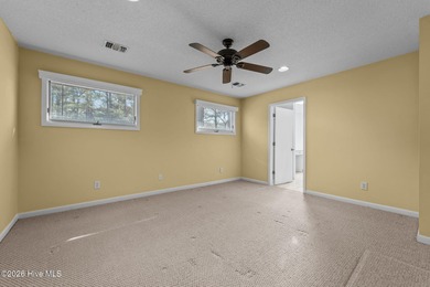 Experience modern living in this contemporary split-level home on Deercroft Golf and Country Club in North Carolina - for sale on GolfHomes.com, golf home, golf lot