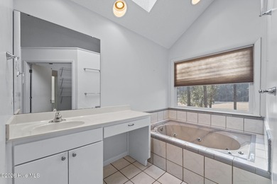 Experience modern living in this contemporary split-level home on Deercroft Golf and Country Club in North Carolina - for sale on GolfHomes.com, golf home, golf lot