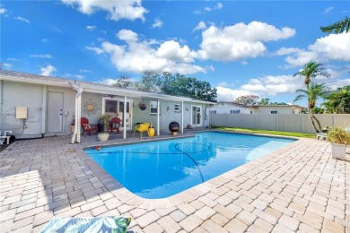This spacious 4-bedroom, 2-bathroom pool home features a on Mangrove Bay Golf Course in Florida - for sale on GolfHomes.com, golf home, golf lot