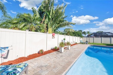 This spacious 4-bedroom, 2-bathroom pool home features a on Mangrove Bay Golf Course in Florida - for sale on GolfHomes.com, golf home, golf lot