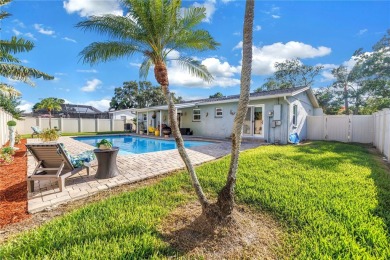 This spacious 4-bedroom, 2-bathroom pool home features a on Mangrove Bay Golf Course in Florida - for sale on GolfHomes.com, golf home, golf lot