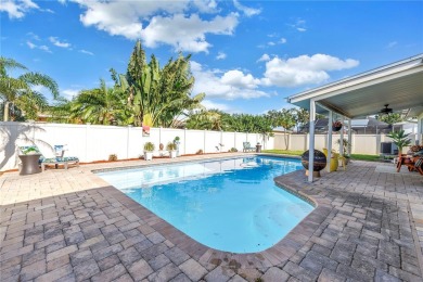This spacious 4-bedroom, 2-bathroom pool home features a on Mangrove Bay Golf Course in Florida - for sale on GolfHomes.com, golf home, golf lot