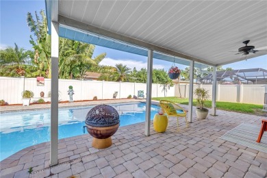 This spacious 4-bedroom, 2-bathroom pool home features a on Mangrove Bay Golf Course in Florida - for sale on GolfHomes.com, golf home, golf lot