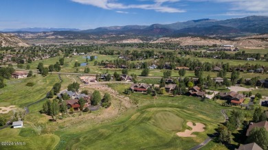 This stunning single-family residence offers 360-degree views of on Eagle Ranch in Colorado - for sale on GolfHomes.com, golf home, golf lot