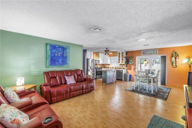 This spacious 4-bedroom, 2-bathroom pool home features a on Mangrove Bay Golf Course in Florida - for sale on GolfHomes.com, golf home, golf lot