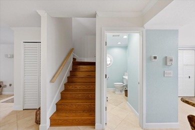 COASTAL RETREAT IN TREASURE ISLAND! Welcome to this on Treasure Bay Golf and Tennis in Florida - for sale on GolfHomes.com, golf home, golf lot