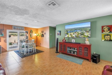 This spacious 4-bedroom, 2-bathroom pool home features a on Mangrove Bay Golf Course in Florida - for sale on GolfHomes.com, golf home, golf lot