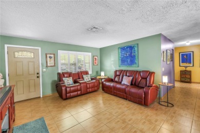 This spacious 4-bedroom, 2-bathroom pool home features a on Mangrove Bay Golf Course in Florida - for sale on GolfHomes.com, golf home, golf lot
