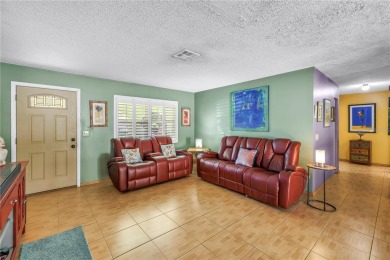 This spacious 4-bedroom, 2-bathroom pool home features a on Mangrove Bay Golf Course in Florida - for sale on GolfHomes.com, golf home, golf lot