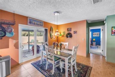 This spacious 4-bedroom, 2-bathroom pool home features a on Mangrove Bay Golf Course in Florida - for sale on GolfHomes.com, golf home, golf lot
