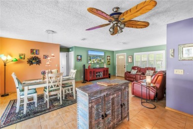 This spacious 4-bedroom, 2-bathroom pool home features a on Mangrove Bay Golf Course in Florida - for sale on GolfHomes.com, golf home, golf lot