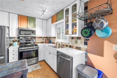 This spacious 4-bedroom, 2-bathroom pool home features a on Mangrove Bay Golf Course in Florida - for sale on GolfHomes.com, golf home, golf lot