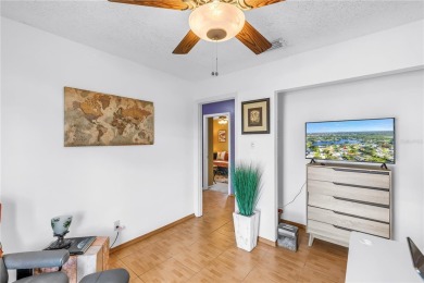 This spacious 4-bedroom, 2-bathroom pool home features a on Mangrove Bay Golf Course in Florida - for sale on GolfHomes.com, golf home, golf lot