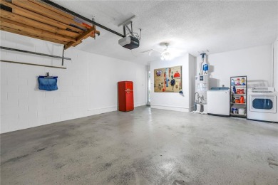 This spacious 4-bedroom, 2-bathroom pool home features a on Mangrove Bay Golf Course in Florida - for sale on GolfHomes.com, golf home, golf lot