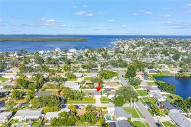 This spacious 4-bedroom, 2-bathroom pool home features a on Mangrove Bay Golf Course in Florida - for sale on GolfHomes.com, golf home, golf lot