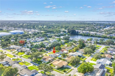 This spacious 4-bedroom, 2-bathroom pool home features a on Mangrove Bay Golf Course in Florida - for sale on GolfHomes.com, golf home, golf lot