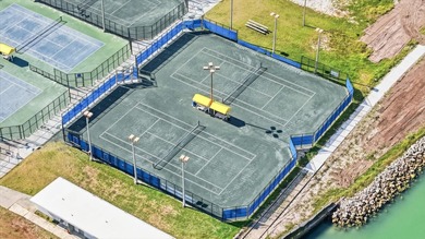 COASTAL RETREAT IN TREASURE ISLAND! Welcome to this on Treasure Bay Golf and Tennis in Florida - for sale on GolfHomes.com, golf home, golf lot