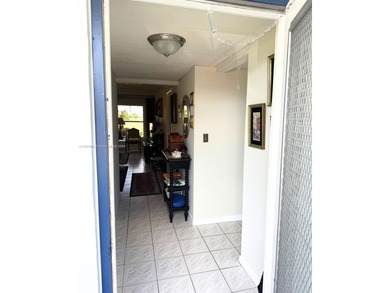 Beautifully maintained 1-bedroom, 1-bathroom condo nestled in a on Oriole Golf and Tennis Club in Florida - for sale on GolfHomes.com, golf home, golf lot