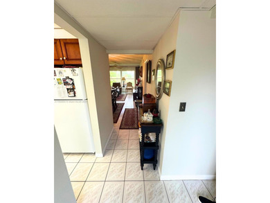 Beautifully maintained 1-bedroom, 1-bathroom condo nestled in a on Oriole Golf and Tennis Club in Florida - for sale on GolfHomes.com, golf home, golf lot