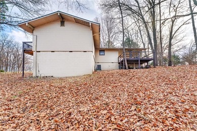 Well-maintained and thoughtfully updated, this three-bedroom on Bella Vista Country Club - Berksdale in Arkansas - for sale on GolfHomes.com, golf home, golf lot