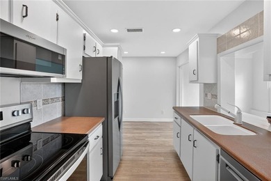 This stunningly renovated end-unit villa offers the ultimate on Quail Run Golf Club In Naples in Florida - for sale on GolfHomes.com, golf home, golf lot