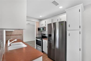 This stunningly renovated end-unit villa offers the ultimate on Quail Run Golf Club In Naples in Florida - for sale on GolfHomes.com, golf home, golf lot