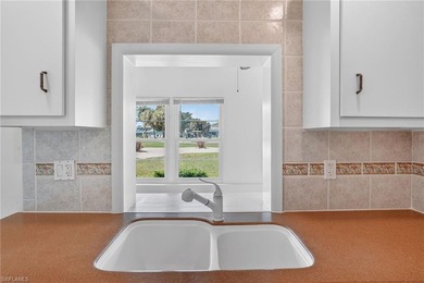 This stunningly renovated end-unit villa offers the ultimate on Quail Run Golf Club In Naples in Florida - for sale on GolfHomes.com, golf home, golf lot