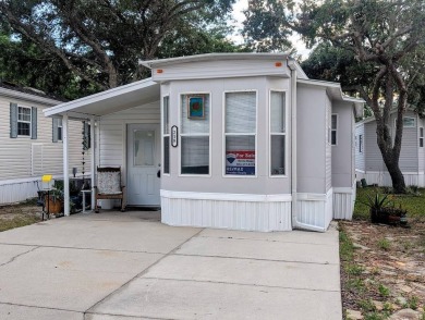 This Unit has a site built addition that includes a laundry or on Cane Garden Golf Course in Florida - for sale on GolfHomes.com, golf home, golf lot