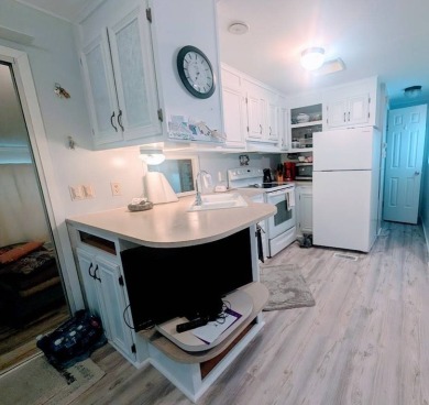 This Unit has a site built addition that includes a laundry or on Cane Garden Golf Course in Florida - for sale on GolfHomes.com, golf home, golf lot