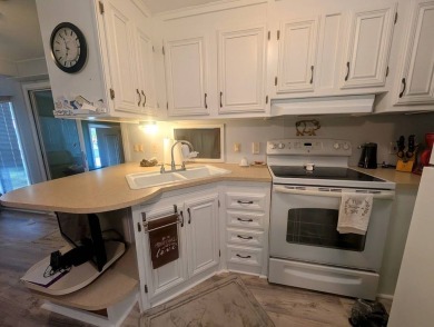 This Unit has a site built addition that includes a laundry or on Cane Garden Golf Course in Florida - for sale on GolfHomes.com, golf home, golf lot