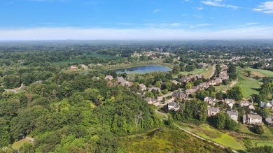 Discover unparalleled elegance in this brick colonial nestled on Beacon Hill Golf Club in Michigan - for sale on GolfHomes.com, golf home, golf lot