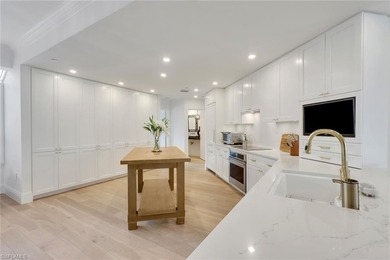 Welcome to this gracious, fully reimagined 2-bedroom plus 2 on Club at Pelican Bay Golf Course in Florida - for sale on GolfHomes.com, golf home, golf lot