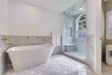 Welcome to this gracious, fully reimagined 2-bedroom plus 2 on Club at Pelican Bay Golf Course in Florida - for sale on GolfHomes.com, golf home, golf lot