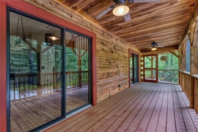 Welcome to 142 Golden Mist Ct! A well-built cabin located at the on Sapphire National Golf Club in North Carolina - for sale on GolfHomes.com, golf home, golf lot
