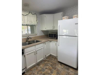 Manufactured Home on Leased Land with Lot Rent. Nestled in the on Whisperwood Golf Course in Florida - for sale on GolfHomes.com, golf home, golf lot