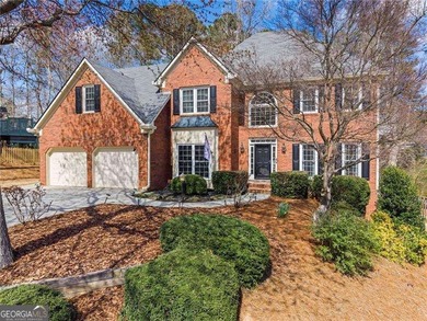 Welcome home to this timeless brick traditional nestled at the on Brookstone Golf and Country Club in Georgia - for sale on GolfHomes.com, golf home, golf lot